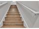 Interior staircase with wood treads and white painted risers at 3965 Aquilla Dr, Lakeland, FL 33810