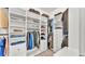 This spacious walk-in closet includes built-in shelving and rods for ample storage at 3965 Aquilla Dr, Lakeland, FL 33810