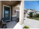 Inviting home porch features stone accents, a modern lantern, and a well-maintained walkway to the front door at 4525 Breccia Ln, Lakeland, FL 33811