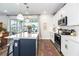 Modern kitchen featuring white countertops, stainless steel appliances, and a center island with pendant lighting at 4525 Breccia Ln, Lakeland, FL 33811