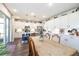 Bright kitchen and dining area featuring a central island, stainless steel appliances, and an open floor plan at 4525 Breccia Ln, Lakeland, FL 33811