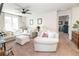 Inviting living room with comfortable seating, neutral color palette, and seamless flow to other areas of the home at 4525 Breccia Ln, Lakeland, FL 33811