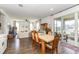 Open-concept living space with hardwood floors and a view into the cozy living room and dining area at 4525 Breccia Ln, Lakeland, FL 33811