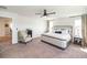 Spacious main bedroom features a bed, chairs, side tables, and neutral decor at 4525 Breccia Ln, Lakeland, FL 33811