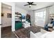 Comfortable sitting room with built-in bookshelves, a patterned rug, and natural light at 4525 Breccia Ln, Lakeland, FL 33811