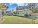 Large backyard with deck, shed, swing, and palm trees at 4620 S Gary Ave, Lakeland, FL 33813