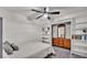 Bedroom featuring a ceiling fan and a dresser with a mirror at 4620 S Gary Ave, Lakeland, FL 33813