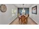 Formal dining room with hardwood floors and decorative lighting fixture at 4620 S Gary Ave, Lakeland, FL 33813