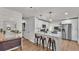 Modern kitchen featuring stainless steel appliances, a breakfast bar, and pendant lighting at 4620 S Gary Ave, Lakeland, FL 33813