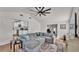 Open concept living room adjacent to kitchen, featuring hardwood floors and neutral decor at 4620 S Gary Ave, Lakeland, FL 33813