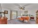 Cozy main bedroom with carpet, a ceiling fan, and a window for natural light at 4620 S Gary Ave, Lakeland, FL 33813