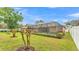 Expansive backyard showcases a screened-in pool and lush landscaping at 4769 Highlands Place Cir, Lakeland, FL 33813