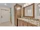 Renovated bathroom featuring a modern vanity with marble countertops and a tiled shower at 4769 Highlands Place Cir, Lakeland, FL 33813