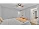 Bedroom featuring neutral paint, a ceiling fan, and a large bed at 4769 Highlands Place Cir, Lakeland, FL 33813