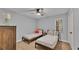 Comfortable bedroom with two twin beds, ceiling fan, and carpeted flooring at 4769 Highlands Place Cir, Lakeland, FL 33813