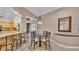 Bright breakfast nook featuring a glass table and view to the lanai at 4769 Highlands Place Cir, Lakeland, FL 33813