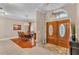 Elegant foyer featuring double doors, tile flooring, and a view into the dining area at 4769 Highlands Place Cir, Lakeland, FL 33813