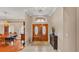 Elegant foyer featuring double doors, tile flooring, and a view into the dining area at 4769 Highlands Place Cir, Lakeland, FL 33813