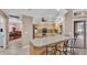 Kitchen featuring a breakfast bar and a view to the dining room and outdoor seating area at 4769 Highlands Place Cir, Lakeland, FL 33813