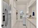 Spacious laundry room with modern appliances, built-in cabinets, and ample counter space at 4769 Highlands Place Cir, Lakeland, FL 33813