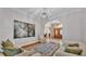 Cozy living room featuring hardwood floors, comfortable seating, and lots of natural light at 4769 Highlands Place Cir, Lakeland, FL 33813