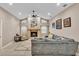 Inviting living room with a cozy fireplace, comfortable seating, and natural light at 4769 Highlands Place Cir, Lakeland, FL 33813