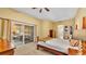 Relaxing bedroom with sliding glass doors leading to an outdoor seating area at 4769 Highlands Place Cir, Lakeland, FL 33813