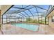 A pristine swimming pool with a screened enclosure for year-round enjoyment at 4769 Highlands Place Cir, Lakeland, FL 33813