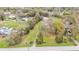 A high-angle view of the property and surrounding trees at 5062 1St Nw St, Lakeland, FL 33810