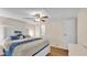 A well-lit main bedroom with hardwood floors and a ceiling fan at 5062 1St Nw St, Lakeland, FL 33810