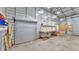 Functional outbuilding space with workshop area and roll up doors at 5062 1St Nw St, Lakeland, FL 33810