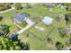 Expansive property featuring a home, pool, metal building, fenced yard, and gazebo at 5118 Eagles Nest Dr, Lakeland, FL 33810