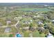 Aerial image showcases this property's ideal location amongst a landscape of mature trees and green meadows at 5118 Eagles Nest Dr, Lakeland, FL 33810