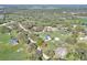 A beautiful aerial view of a home surrounded by lush trees and greenery in a rural area at 5118 Eagles Nest Dr, Lakeland, FL 33810