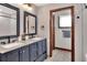 Stylish bathroom featuring a double sink vanity with granite counters and modern fixtures at 5118 Eagles Nest Dr, Lakeland, FL 33810