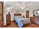 Comfortable bedroom with wood floors, ceiling fan, and stylish decor at 5118 Eagles Nest Dr, Lakeland, FL 33810