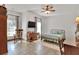 Comfortable bedroom with tile floors, natural light, ceiling fan, and traditional wood furniture at 5118 Eagles Nest Dr, Lakeland, FL 33810