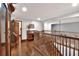 Spacious foyer with hardwood floors, staircase, and views of the upper-level hallway at 5118 Eagles Nest Dr, Lakeland, FL 33810