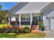 Cozy front porch with brick accents and decorative plantings at 5118 Eagles Nest Dr, Lakeland, FL 33810