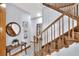 Inviting hallway with hardwood floors, a staircase, and natural light from nearby rooms at 5118 Eagles Nest Dr, Lakeland, FL 33810