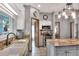 View of kitchen features granite countertops, stainless steel appliances, a large sink, and custom lighting at 5118 Eagles Nest Dr, Lakeland, FL 33810