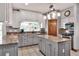 Modern kitchen featuring granite countertops, stainless steel appliances, and a center island with cabinets at 5118 Eagles Nest Dr, Lakeland, FL 33810