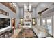 Living room with soaring ceilings, white brick fireplace, and loft at 5118 Eagles Nest Dr, Lakeland, FL 33810