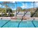 Sparkling in-ground pool features a built-in spa, perfect for unwinding and entertaining guests at 5118 Eagles Nest Dr, Lakeland, FL 33810