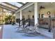 Relaxing pool patio with chaise lounges and covered seating area at 5118 Eagles Nest Dr, Lakeland, FL 33810