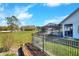 Tranquil fenced backyard with a screened-in pool, offering a peaceful retreat for outdoor activities at 5118 Eagles Nest Dr, Lakeland, FL 33810