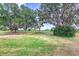 Expansive backyard features mature trees with Spanish moss, offering a serene and natural setting at 5225 Imperial Lakes Blvd # 49, Mulberry, FL 33860