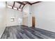 Spacious living room featuring vaulted ceilings with exposed beams and wide plank flooring at 5225 Imperial Lakes Blvd # 49, Mulberry, FL 33860