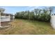 Lush backyard with a white fence line and an enclosed porch at 5252 Montserrat Dr, Lakeland, FL 33812