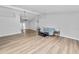 Open living room featuring wood-look flooring, neutral paint, and a vaulted ceiling at 5252 Montserrat Dr, Lakeland, FL 33812